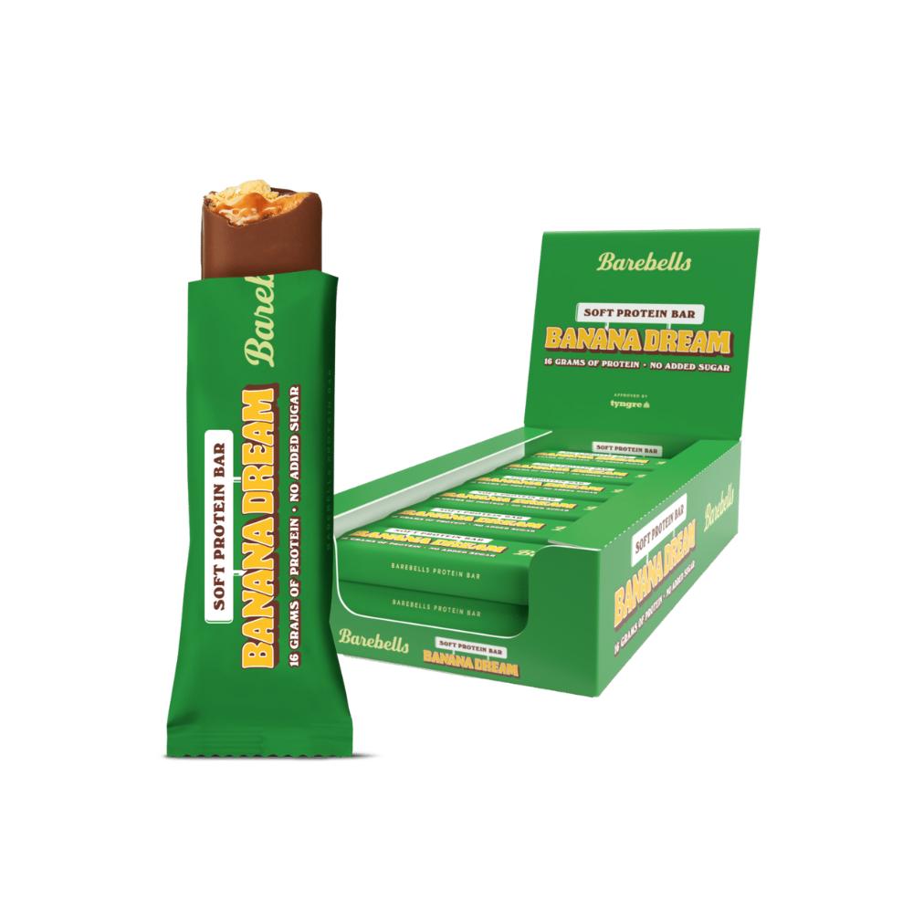 Barebells Banana Dream Soft Protein Bar, green wrapper, milk chocolate, caramel, and banana core visible, with a display box.