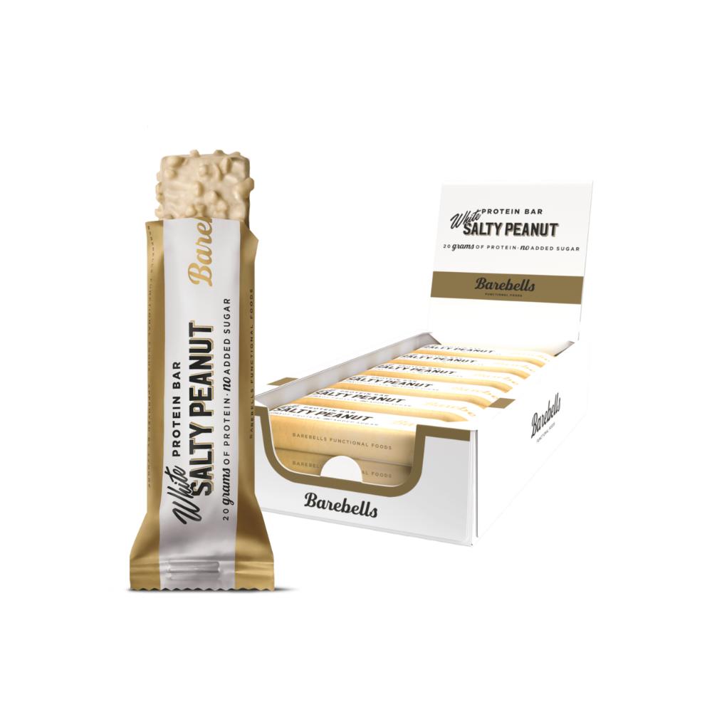 Barebells White Salty Peanut protein bar, unwrapped to show the white chocolate coating and peanut pieces, next to a display box of 12 bars.