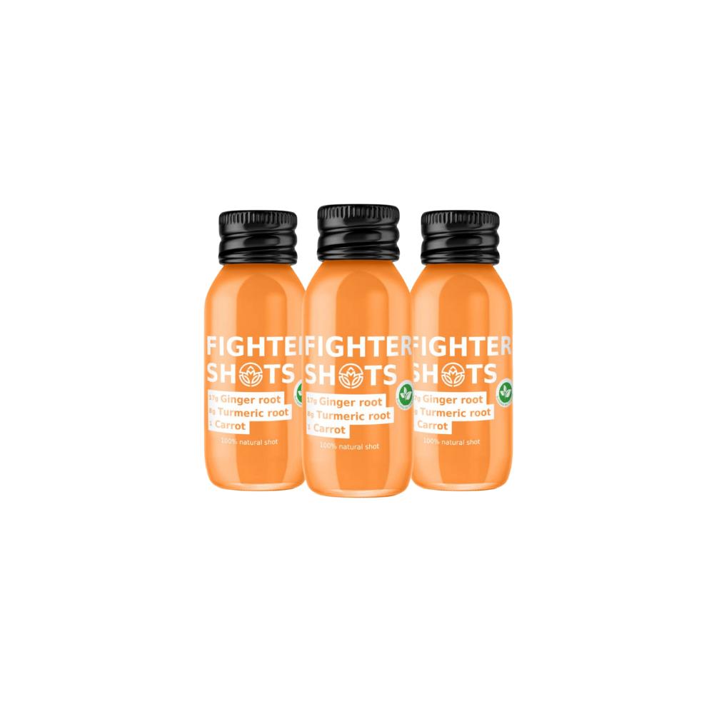 Three orange Fighter Shots, 60ml bottles with black caps, featuring ginger, turmeric, and carrot ingredients.
