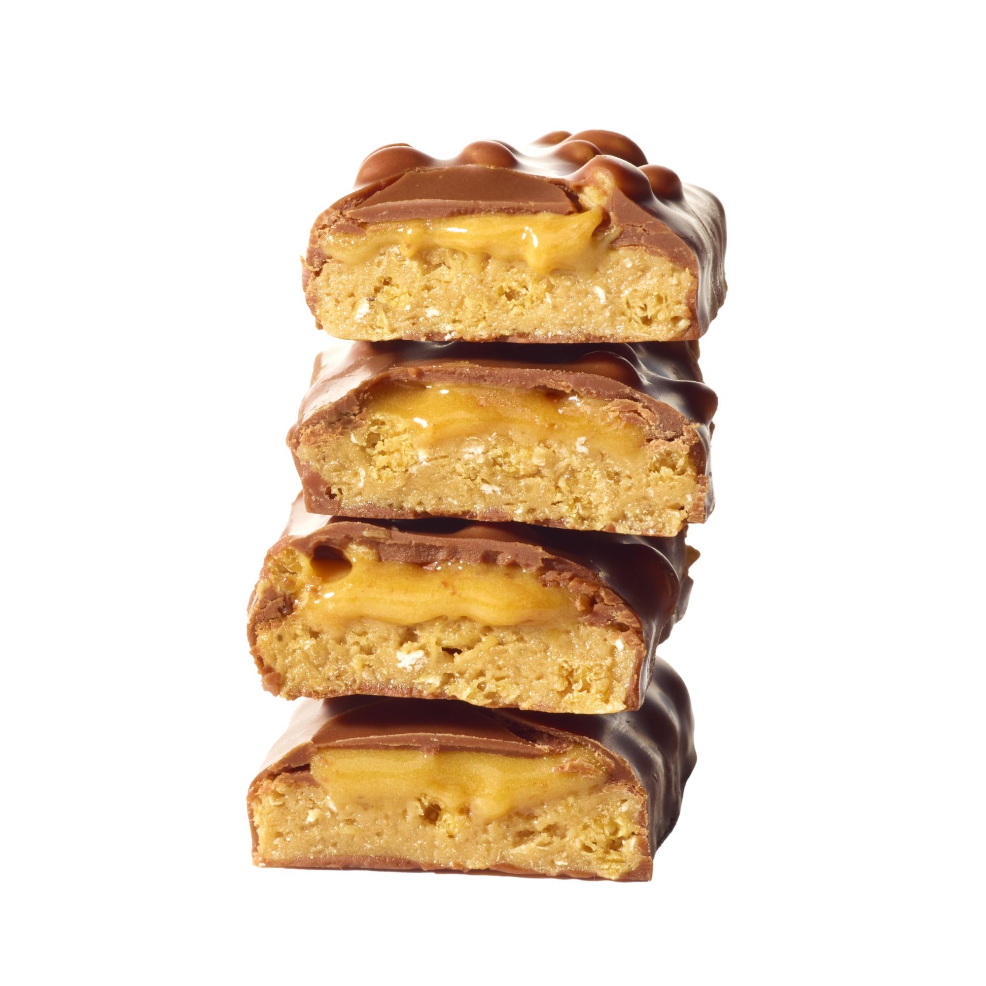 Stack of four YuBi Bar Peanut Protein Bars, cut in half, revealing golden caramel, crunchy crispies, and chocolate coating.