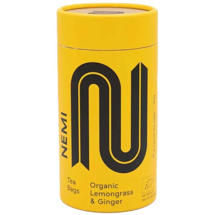 Yellow NEMI Tea tube with black "N" logo, "Organic Lemongrass & Ginger" text.