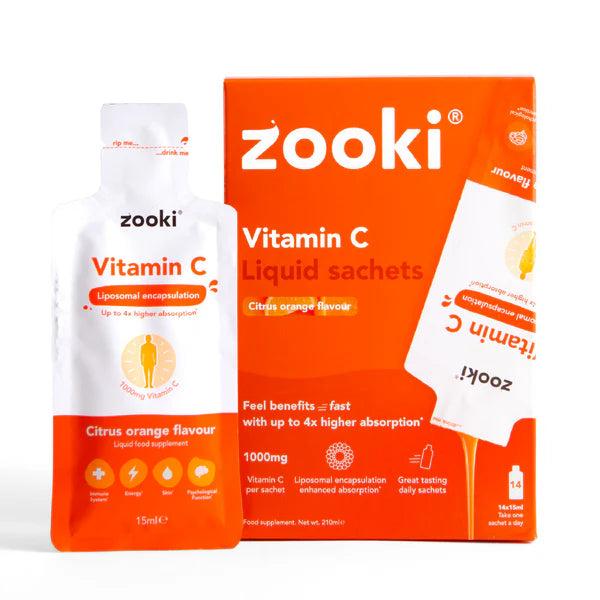 Zooki Vitamin C liquid sachets in citrus orange flavor, showing an open sachet and the orange box.