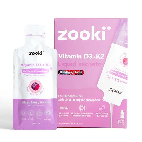 Zooki Vitamin D3+K2 mixed berry liquid sachets in a white and pink box with one sachet visible.