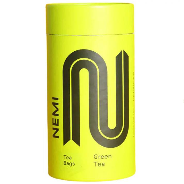 Bright yellow NEMI Tea Green Tea tube with black logo and text.
