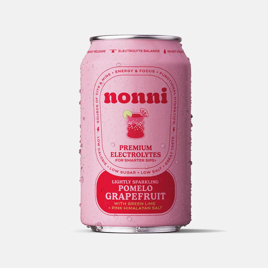 Dewy pink Nonni sparkling pomelo grapefruit can with green lime and pink Himalayan salt.