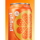 Close-up of a wet Poppi Orange Prebiotic Soda can with a citrus slice design and "5g Sugar" label.