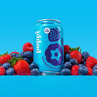 Poppi Wild Berry prebiotic soda can, light blue with berry graphics, surrounded by fresh raspberries, blueberries, and strawberries.