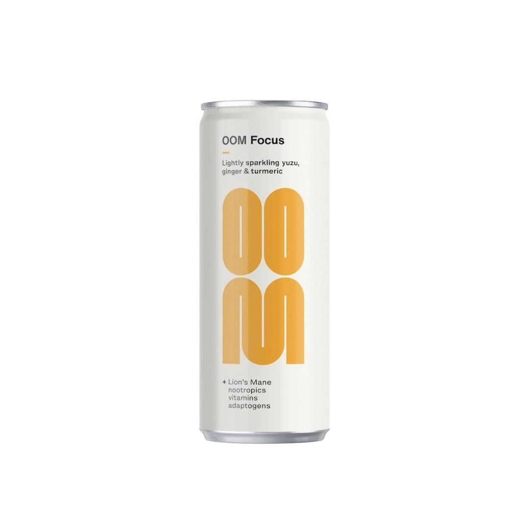 White OOM Focus 250ml can with large orange "OOM" logo and text "lightly sparkling yuzu, ginger & turmeric".