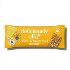 Deliciously Ella Lemon & Poppy Seed Oat Bar in yellow packaging with a lemon slice and poppy seeds.