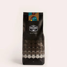 Volcano Coffee Works "The Brixton" dark roast coffee bag with geometric pattern.