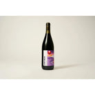 Dark red wine bottle with a purple and orange abstract label featuring "OTHER DÓLDORA".