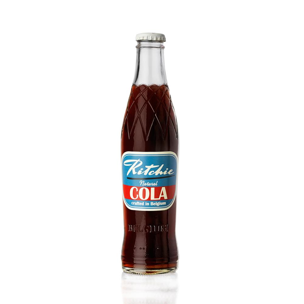 Ritchie Natural Cola in a clear glass bottle with a retro blue and red label, silver twist-off cap.