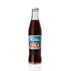 Ritchie Natural Cola in a clear glass bottle with a retro blue and red label, silver twist-off cap.