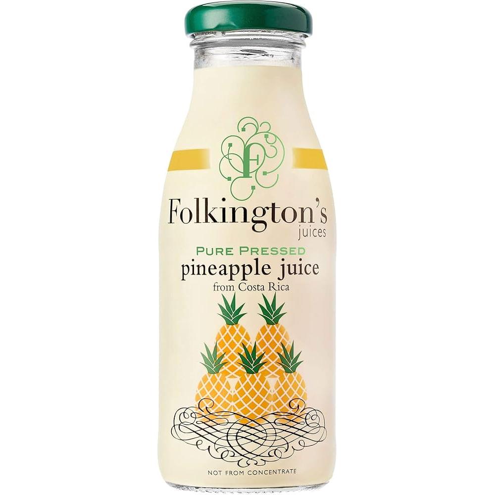 Folkington's Pure Pressed Pineapple Juice in a clear glass bottle with a green cap and yellow label.