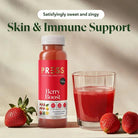 PRESS Berry Boost juice bottle with a glass of red juice, fresh strawberries, and mint.