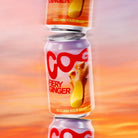 Stack of three COG Fiery Ginger soda cans with purple and orange labels, featuring ginger root.