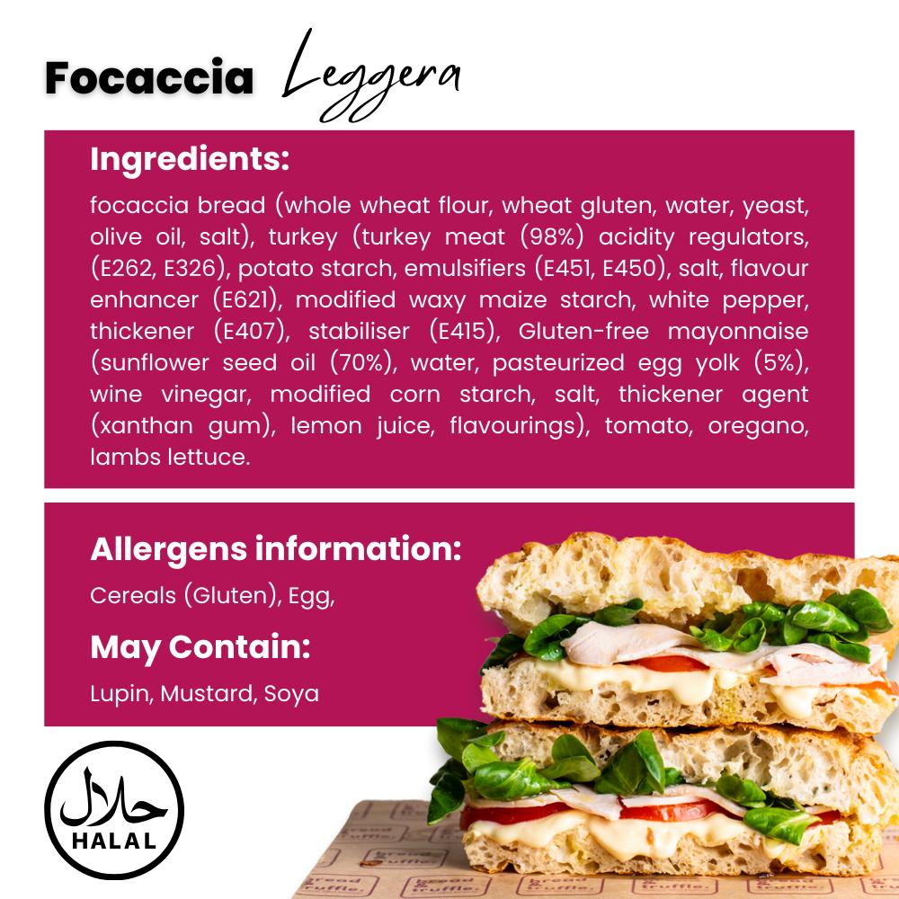 Two halves of a Leggera Focaccia sandwich with turkey, egg mayo, tomato, oregano, and lamb's lettuce.