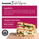Twisted Caprese Focaccia Sandwich with fresh mozzarella, vine tomatoes, and basil sauce on rustic bread.