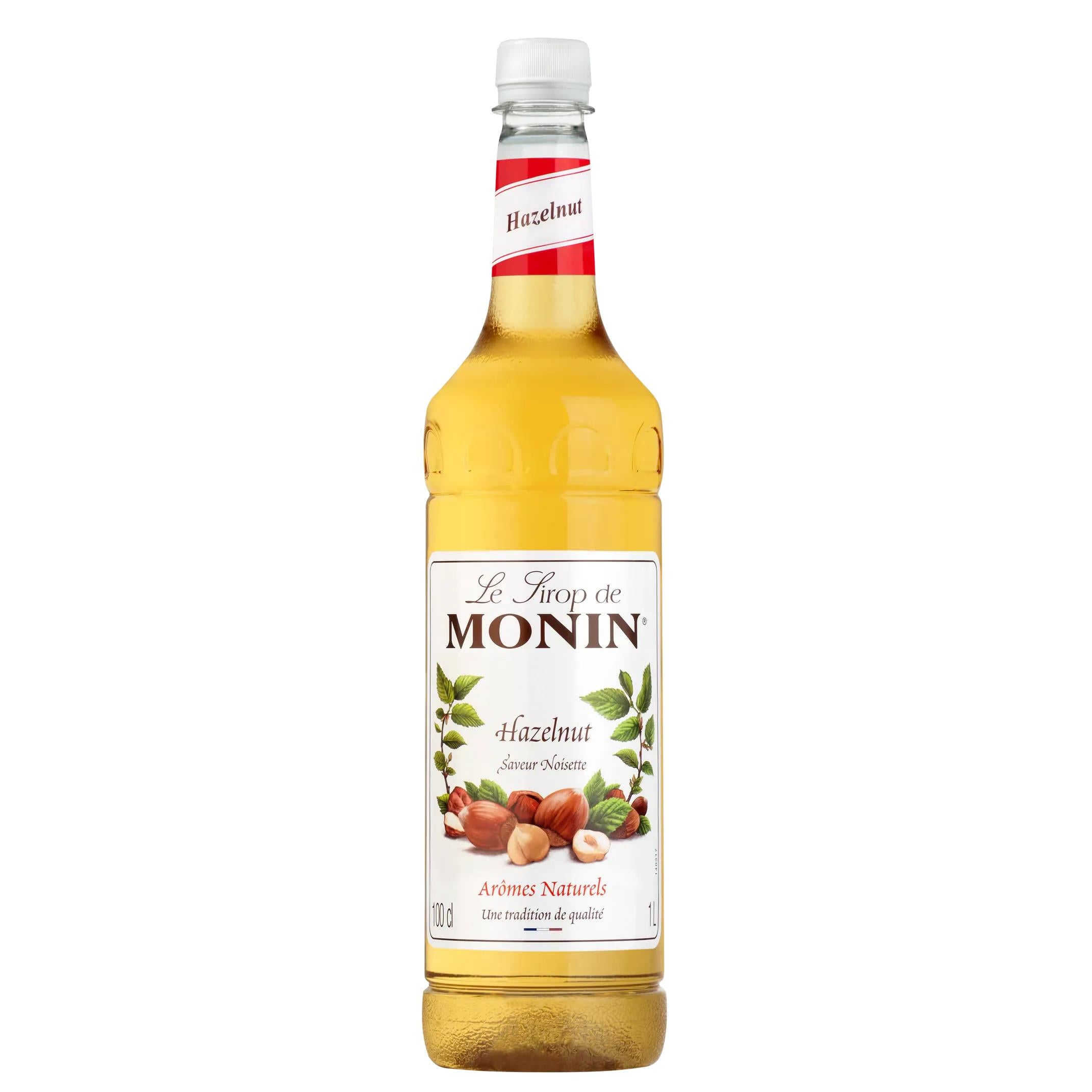 Monin Hazelnut Syrup 1L in a clear glass bottle with a white cap and hazelnut label.