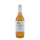 Marna Mango Iced Tea in a clear glass bottle with a white label and silver cap.