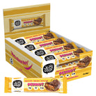 Open display box of 12 YuBi Bar Peanut Protein Bars, showing yellow wrappers with chocolate-covered bars.
