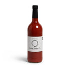 The Pickle House Spiced Tomato Mix in a clear 750ml glass bottle with a black cap and white label.