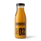 Clear glass bottle of orange smoothie with black label, "SMOOTHIE 02" and fruit names.