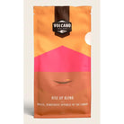 Volcano Coffee Works Rise Up Blend coffee bag with orange, pink, and brown design.
