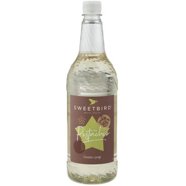 Sweetbird Pistachio 1L syrup bottle with a brown and green label featuring nuts.