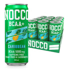 Green NOCCO Caribbean BCAA+ 330ml can with pineapple design, next to a 12-pack tray of cans.