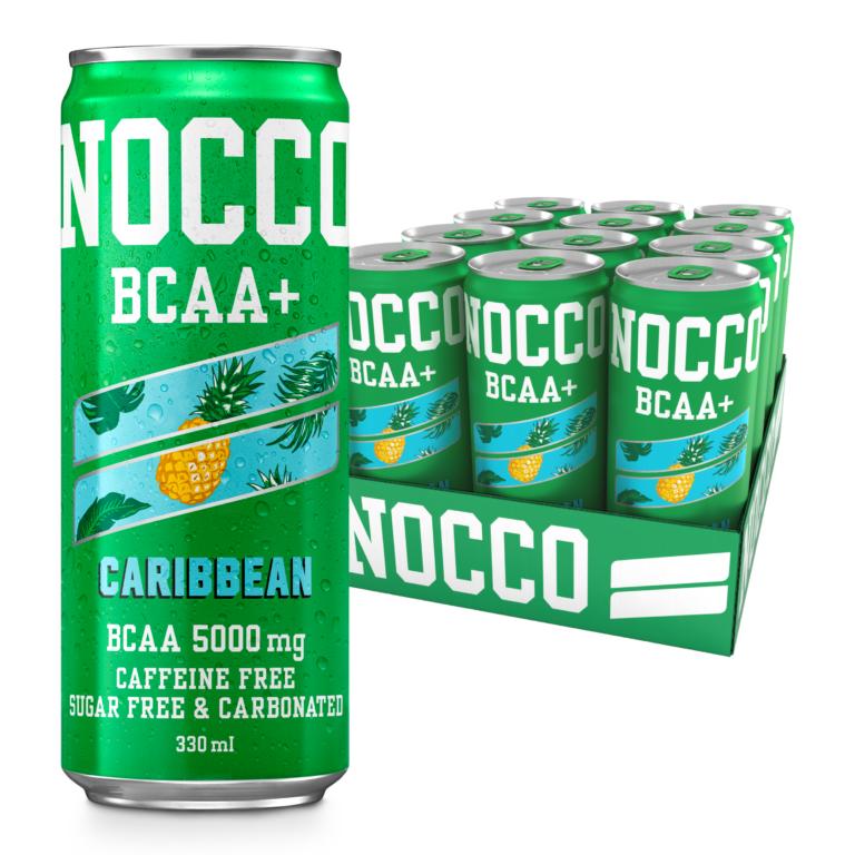 Green NOCCO Caribbean BCAA+ 330ml can with pineapple design, next to a 12-pack tray of cans.