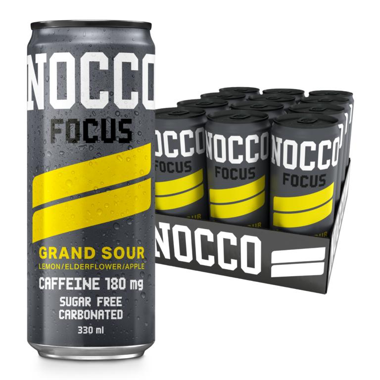 NOCCO Focus Grand Sour 330ml can, dark grey with yellow stripes, next to a 12-pack tray.