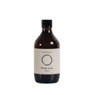 Dark brown glass bottle of The Pickle House Original Pickle Juice with a white label and black cap.