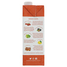 Back of an orange Goji Berry juice carton with white cap, detailing ingredients like passionfruit, grape, lemon, and turmeric.