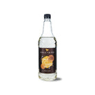 Sweetbird 1L clear glass bottle of Cane Sugar Classic Syrup with a black cap and brown label.