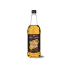 Sweetbird French Vanilla Classic Syrup 1L in a clear glass bottle with a black cap and label.